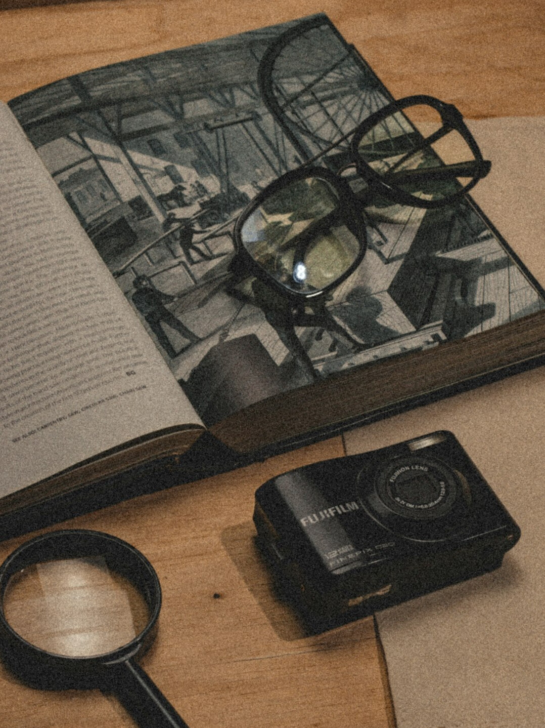vintage book pages with magnifying glass